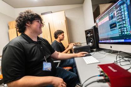 students practicing sound mixing in the recording studio 